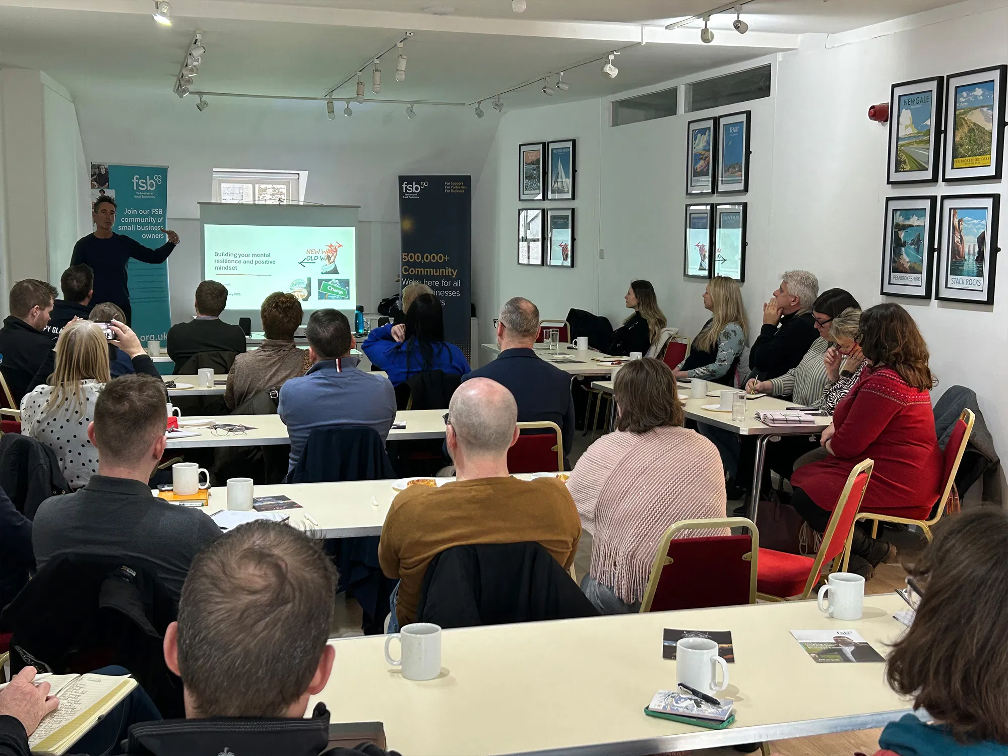 Professionals taking part in an interactive mental resilience and positive mindset training session